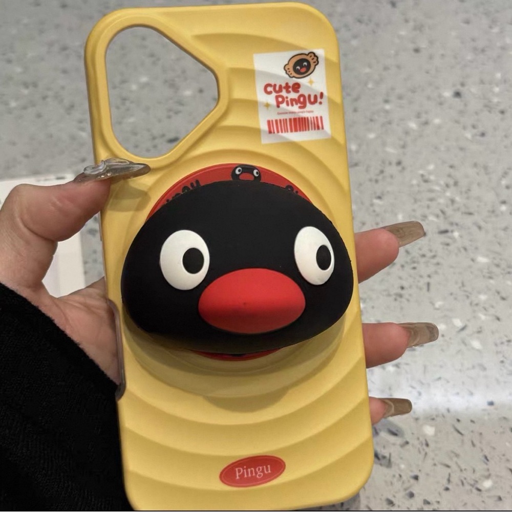 Ping Yellow and Black Cartoon Phone Case iPhone 15 brand new with phone holder